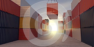 Stacked industrial intermodal cargo transport or shipping containers storage with one container on crane outside with sunset sky