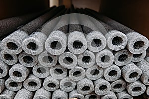 Stacked insulation for pipes of polyethylene foam in warehouse