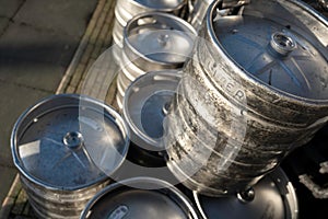 Stacked large metal beer barrels