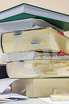 Stacked law books on the desk in an office