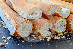 Stacked Loaves of French Bread with Ends Removed