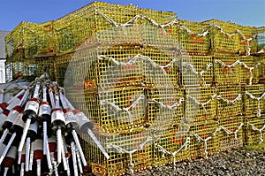 Stacked lobster traps and a pile of buoys