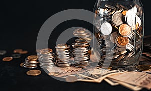 Stacked money grow on a black background