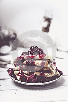 Stacked pancakes with fresh berries