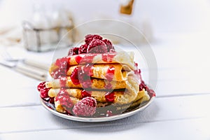 Stacked pancakes with fresh berries