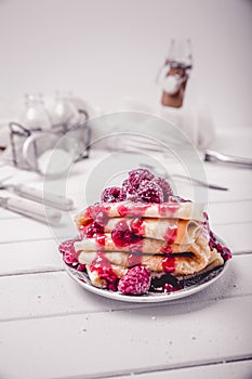 Stacked pancakes with fresh berries