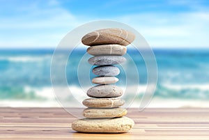 Stacked pebbles to make shape of hourglass as a symbol of time management.