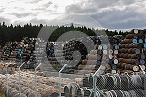 Stacked pile of old wooden barrels and casks at Speyside Cooperage in Scotland