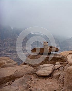 Stacked pile of stones and rocks on tranquil desert background