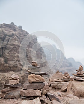Stacked pile of stones and rocks on tranquil desert background