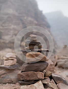 Stacked pile of stones and rocks on tranquil desert background