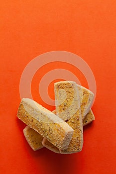Stacked Pistachio cookies or butter Pista bakery cookies, on orange background. photo