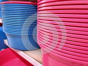 Stacked Plastic Washtubs on Shelf