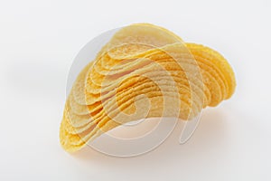 Stacked potato chips on a white background.