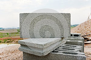 Stacked rectangular concrete blocks on the construction site. building materials.