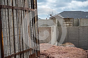 Stacked removable concrete forms for a basement at a residential home construction site