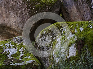 Stacked rock boulders with moss