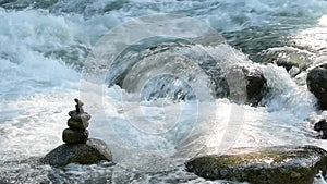 Stacked rocks along an Alaska river