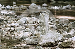 Stacked rocks, balancing in a streambed, balanced rock pile