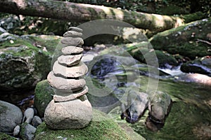Stacked Rocks on side of mountain stream