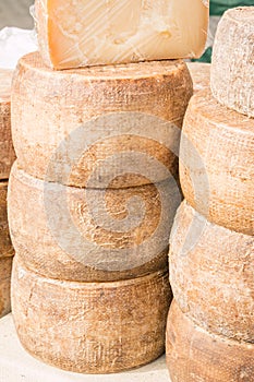 Stacked rounded cheese for sale in market