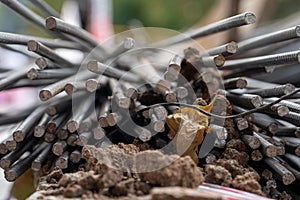 Stacked of rusty metal steel rods on the construction site