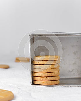 stacked Sable Breton biscuits in metal tin