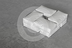White sacks on the concrete floor. 3d render