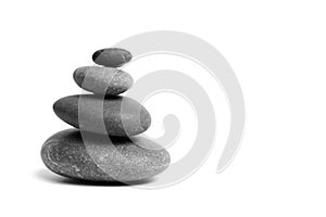 Stacked smooth grey stones. Sea pebble. Balancing pebbles isolated on white background
