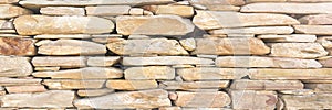 Stacked stone wall background horizontal. White stone tile texture brick wall background.