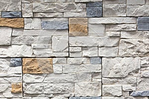 Stacked stone wall, natural stone cladding. Stone wall for background,Slab stone wall texture. Wall background of volcanic