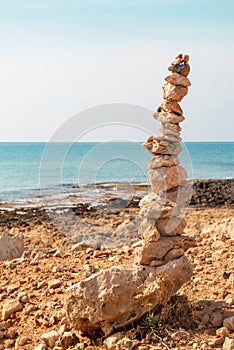 Stacked stones against the sea. Concept of harmony and balance