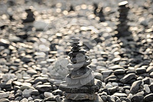 Stacked stones on a background of beach