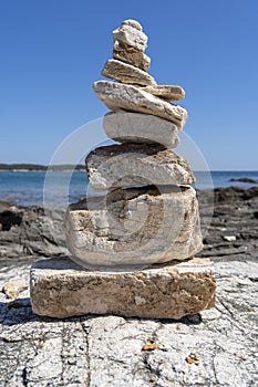 Stacked stones on a rocky beach in the Aegean sea