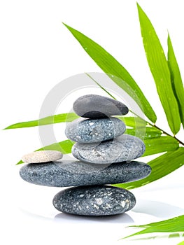 The stacked of Stones spa treatment scene and bamboo leaves .