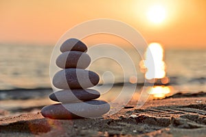 Stacked stones and sunset