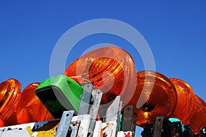 Stacked up construction hazard barricades with lights