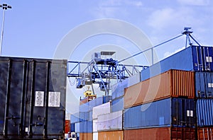 Stacked up shipping containers at container terminal in port