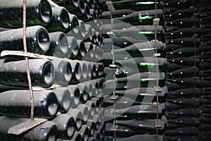 Stacked up wine bottles in the cellar