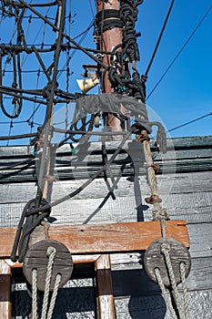 Stacked and well-folded ropes on the deck of a sailing ship. Accessories needed for sailing