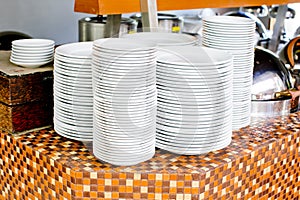 Stacked white dishes photo