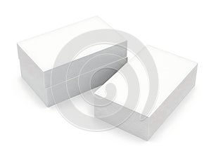 Stacked white rectangular blocks on a plain surface