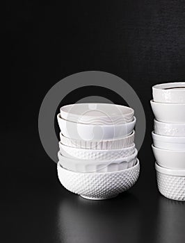 Stacked white textured soup bowls