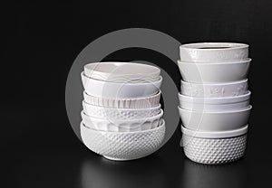 Stacked white textured soup bowls