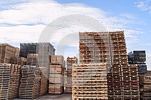 Stacked wood pallets and material