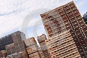 Stacked wood pallets and material