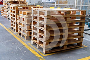 Stacked wooden pallets at a storage