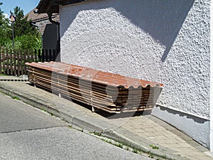 Stacked wooden slats on a house wall