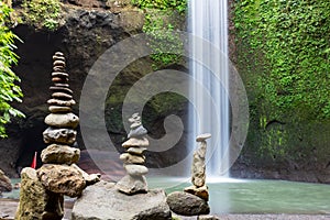Stacked zen stone at Tibumana Waterfall in Ubud Bali Indonesia