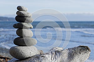Stacked Zen Stones and Ocean Background